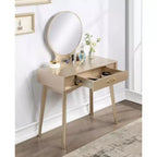 Coiffeuse moderne avec miroir rond, rangement organisé, tabouret assorti pour chambre à coucher, finition dorée, design peu encombrant