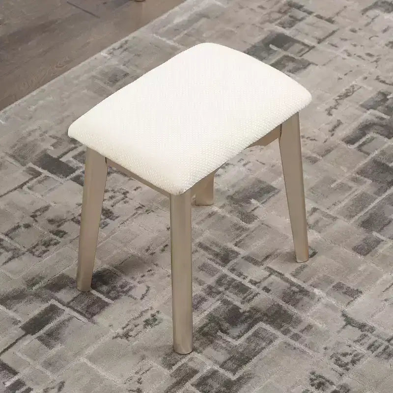 Coiffeuse moderne avec miroir rond, rangement organisé, tabouret assorti pour chambre à coucher, finition dorée, design peu encombrant